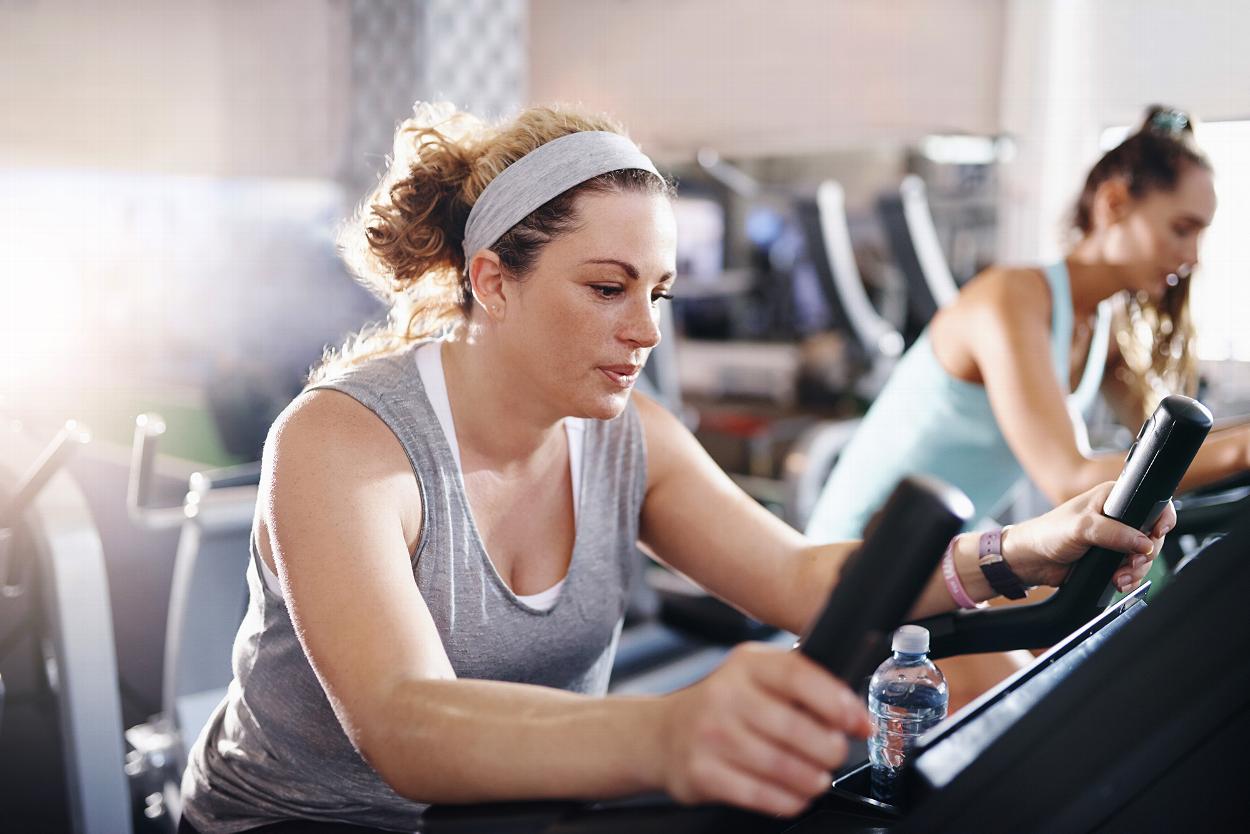 Woman on cardio machine at gym